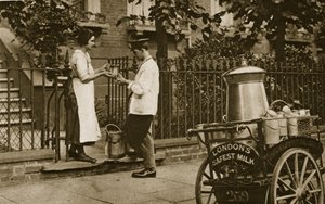 A North London Milkman and his three-wheeled trolley by English Photographer